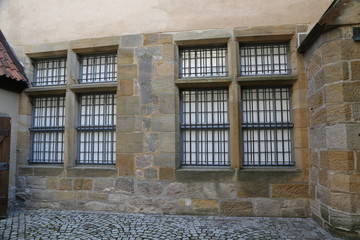 Fototapeta na wymiar Metal bars on the Windows and doors of the Castle