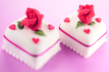 TWO ICED LOVE CAKES
