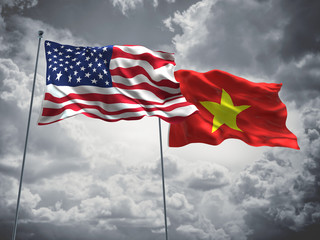 United States of America, USA & Vietnam Flags are waving in the sky with dark clouds