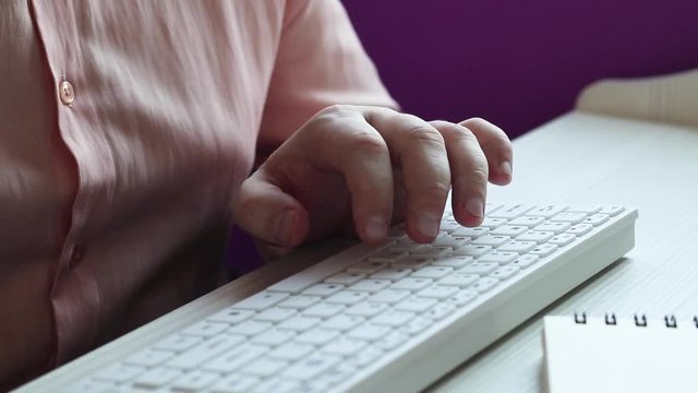 Close-up of man using computer / HD stock photos of man hands typing on computer keyboard and drinking coffee