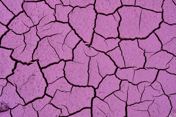 Cracked clay soil Texture, background, seamless pattern. Crack in the ground. Texture, background, seamless pattern. This is useful for designers. a crack in the ground, drought, sun. absence of water