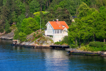 Fototapeta na wymiar Finland, small red houses on an island in the Baltic Sea