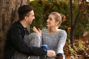 Loving young couple in autumn park