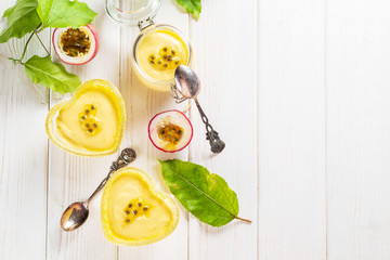 Passion fruit mousse on white wooden background