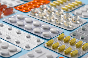 Assortment different new pharmacy pills and drugs in blisters closeup