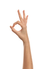 Female hand showing OK gesture on white background