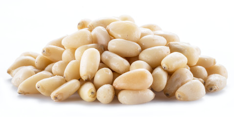 Pine nuts on the white background. Organic food.