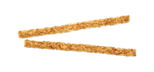 Cracker pretzel bread sticks with sesame isolated on white background, top view