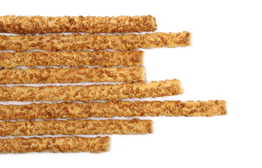 Cracker pretzel bread sticks with sesame isolated on white background, top view