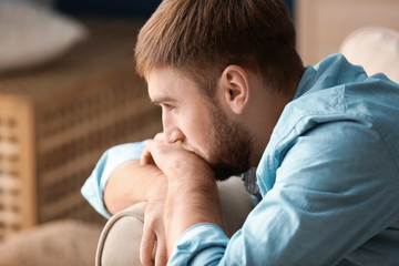 Lonely depressed man at home