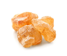 Pieces of sugar on white background