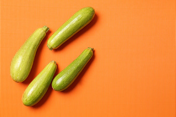 Fresh squashes on color background