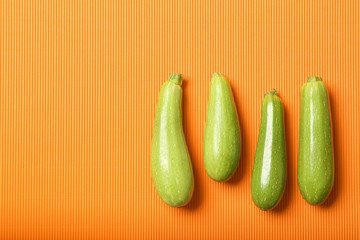 Fresh squashes on color background