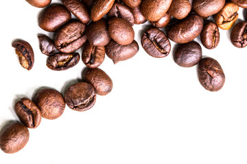 Roasted coffee beans isolated on a white background.