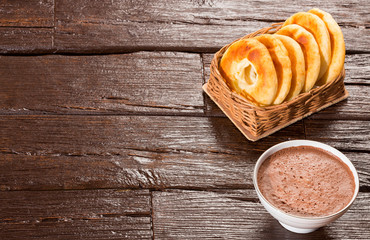 Pandequeso traditional Colombian food - Hot drink chocolate