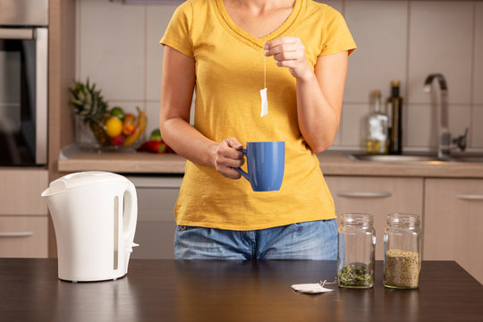 Woman making a cup of tea