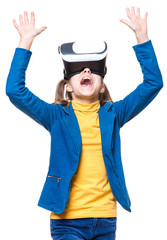 Happy little girl wearing virtual reality goggles watching movies or playing video games. Cheerful smiling teenager looking in VR glasses. Funny child experiencing 3D gadget technology - close up.