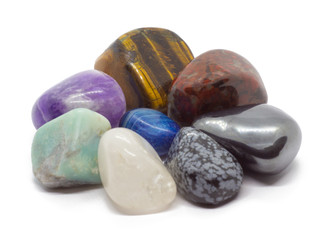semiprecious stones of different types and colors, isolated on white background