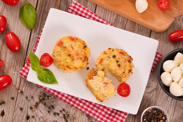 Potato gratins with mozzarella and tomatoes.