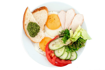 Fried eggs with vegetables, chicken slices and white toast isolated on white background. top view. flat lay
