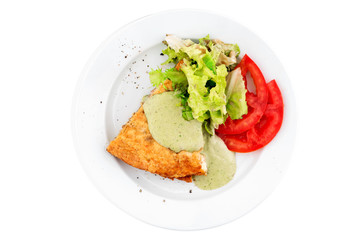 Vegetable pie with spinach dressing, fresh vegetables and lettuce in a white plate isolated on white background. top view. flat lay