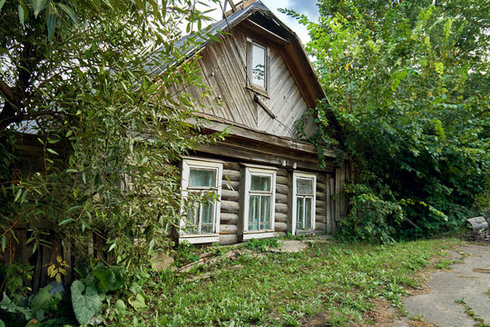 Leaning crumbling house in a small russian town