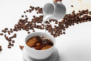 Coffee bean small cup full of coffee bean isolated on white