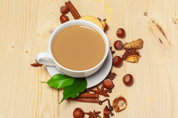 Coffee cup with saucer on a wooden background top view