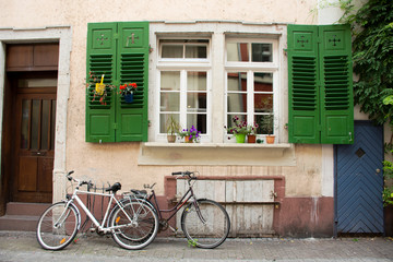 Fototapeta na wymiar German people stopping and lock bicycle at front of classic and retro house in Heidelberg, Germany