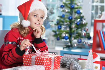 Portrait of cute girl with Christmas present