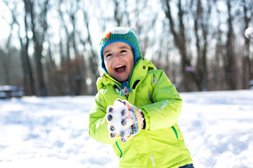 Little boy enjoying his time in the snow