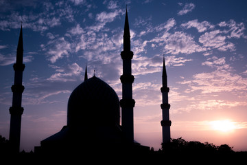 Mosque silhouette with beautiful sunrise in the background 