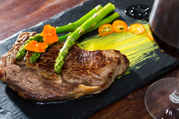 Well done beef steak with asparagus