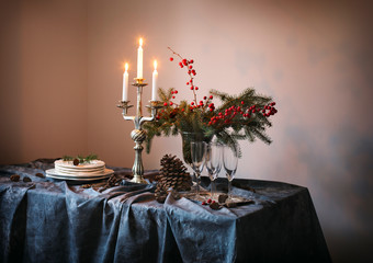Christmas table setting. Champagne glasses and candles on the table