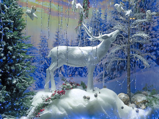 Background. New Year's holiday decoration of the winter snow-covered forest. Deer