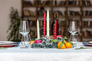 Holiday festive table set with library at background