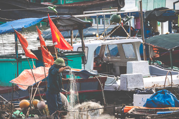Floating fishing village and fishing boats in Cat Ba Island, Vietnam, Southeast Asia. UNESCO World Heritage Site. © Curioso.Photography