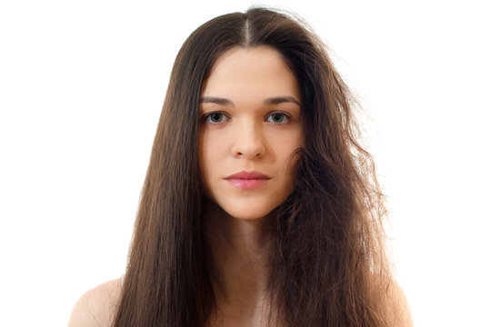 Young woman with well-groomed combed and problem unkempt hair. White background close up