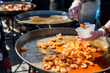 Pan with roasted prawns for sale outdoors