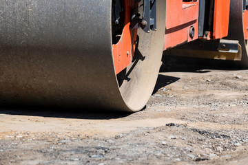 Road roller compactor at asphalt road repairing