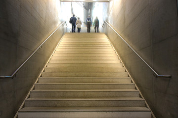 tourist people hustle going up the stairs departure from subway station