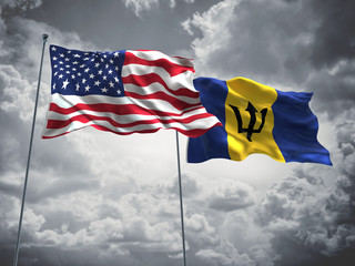United States of America, USA & Barbados Flags are waving in the sky with dark clouds