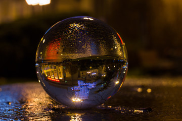 Palace of Culture and Science Warsaw - captured flipped reflection in crystal ball at night in...