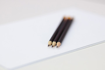 Close up pencil on white paper on desk