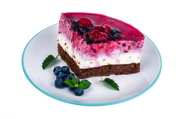 Piece of cake with berries and jelly