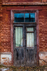 old wooden window in an old brick wall