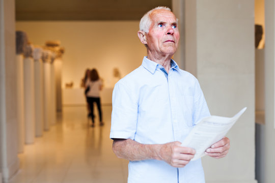 Man observing exhibition in museum