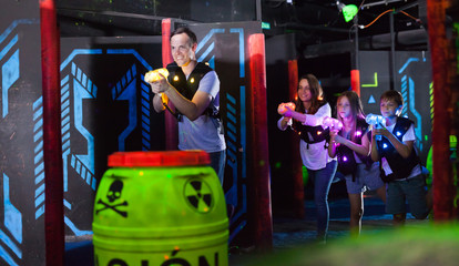 Kids and adults on lasertag arena
