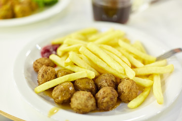 fast food restaurant. fried potatoes, meatballs.