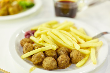 fast food restaurant. fried potatoes, meatballs.